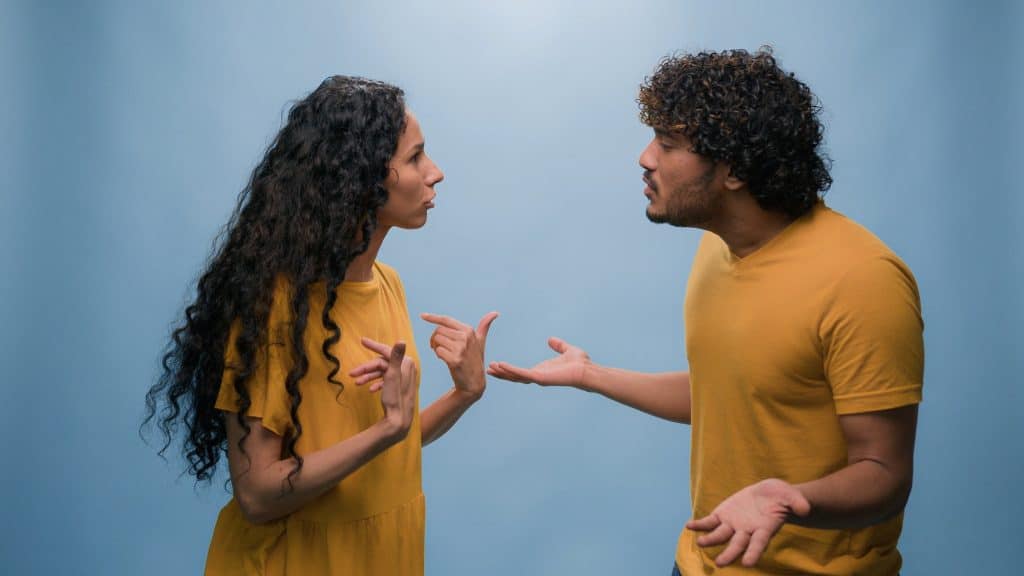 Multiracial couple quarrel offended Arabian Indian man husband argue with angry Latino Hispanic