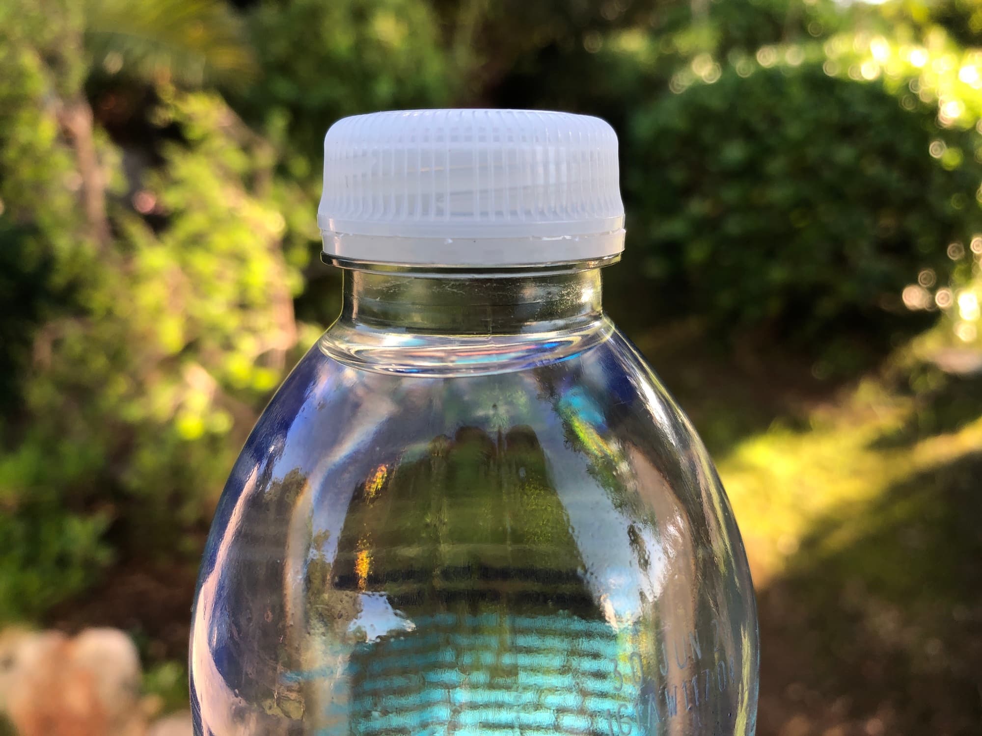Plastic water bottle with a screw top, close up, outdoors