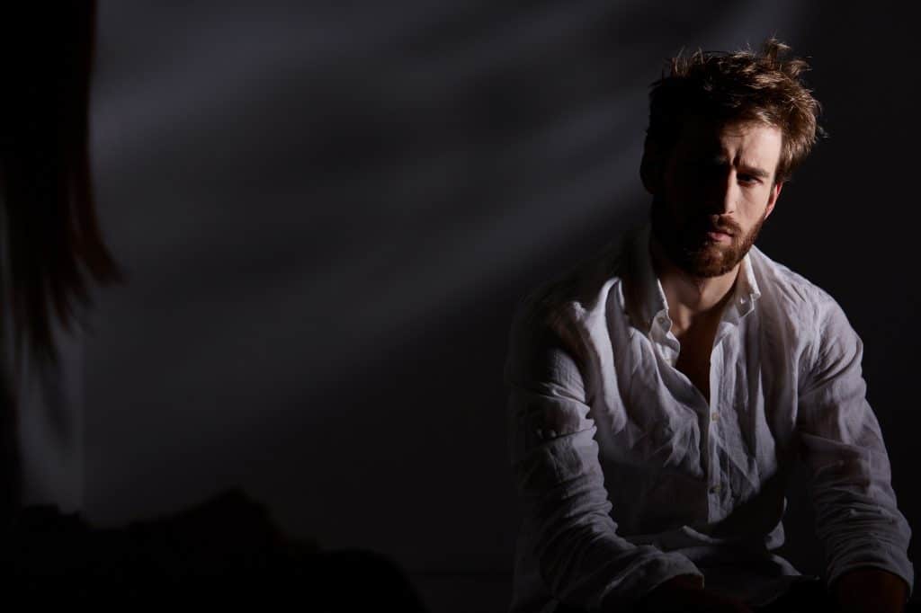 Depressed man sitting alone