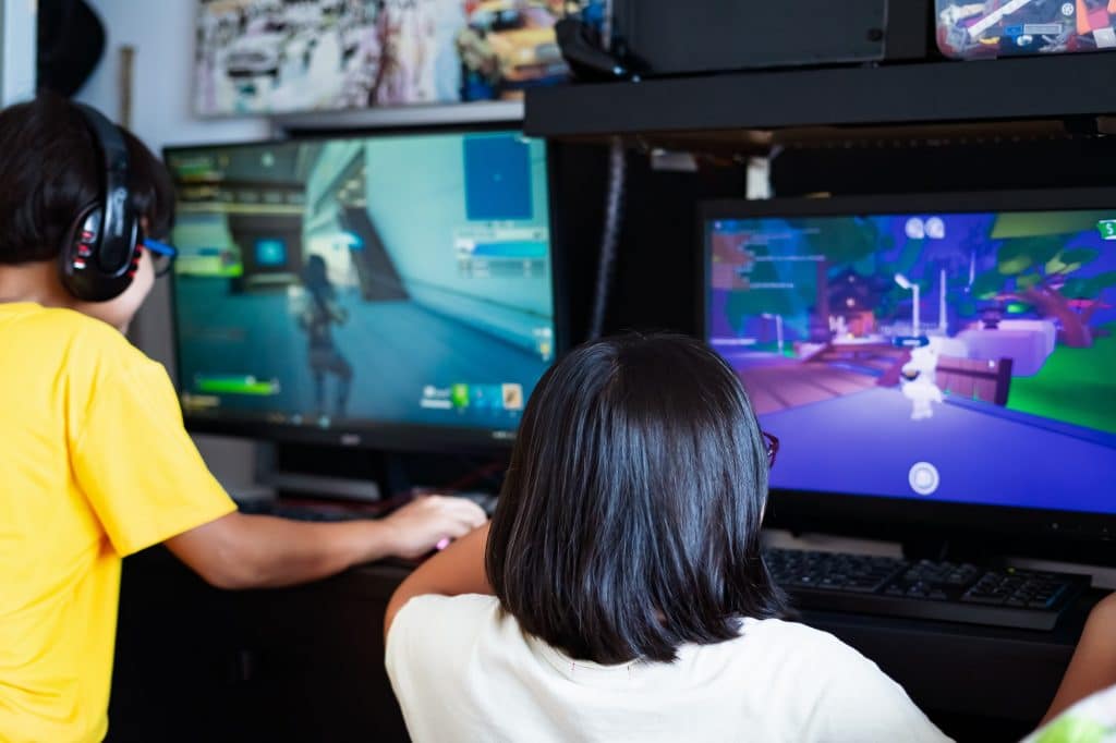Playing video games at home.