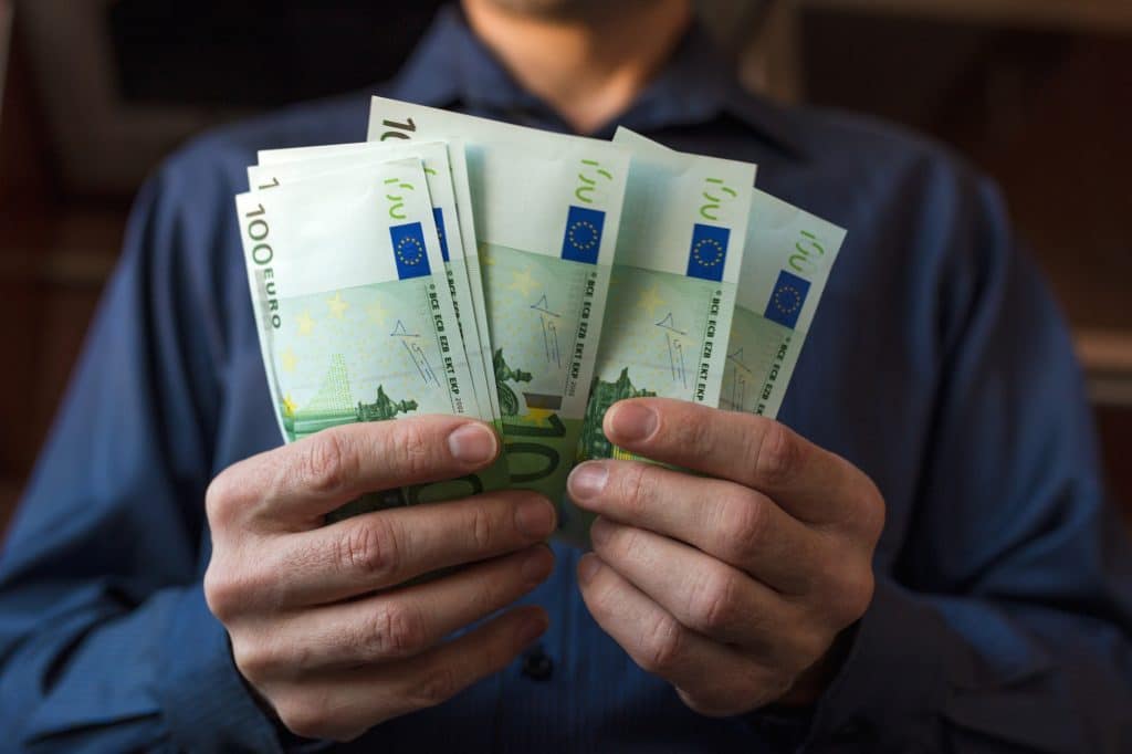 Men's hands count Euro bills cash money