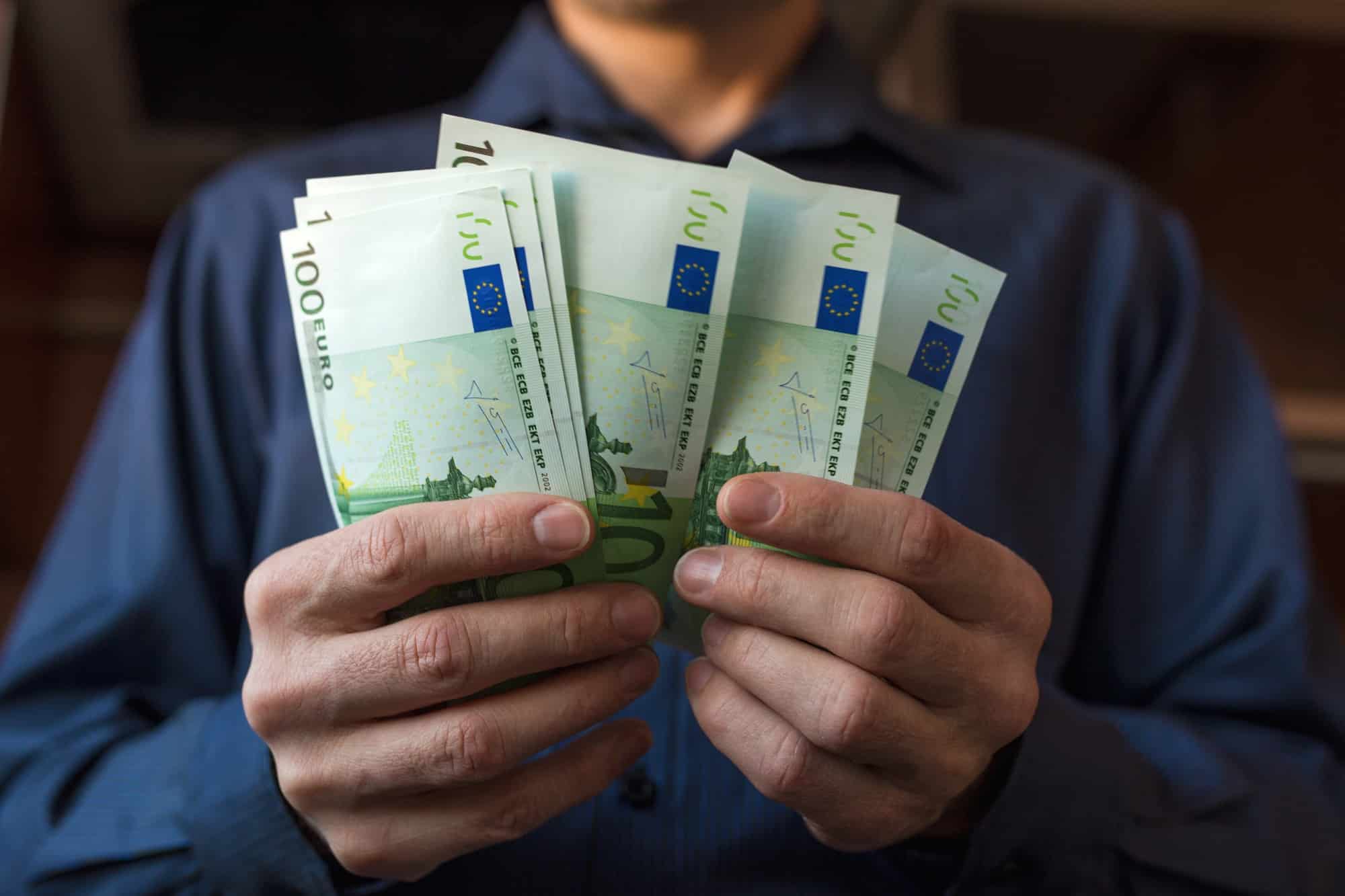 Men's hands count Euro bills cash money